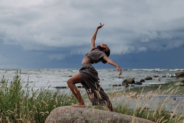 A person in a fluid motion pose suggesting continuous movement.